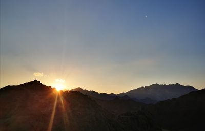 Scenic view of mountains against sky during sunset