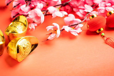 High angle view of red and white flowers on table
