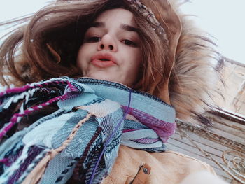 Low angle view of woman wearing warm clothing