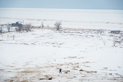 Scenic view of snow field against sky