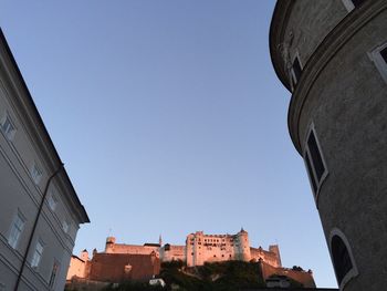 Low angle view of castle against clear blue sky