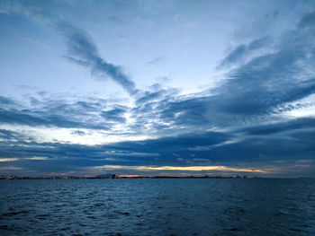 Scenic view of sea against dramatic sky