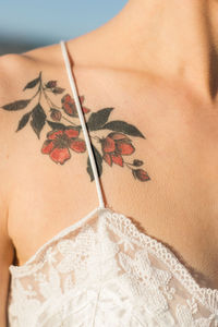 Close-up of tattoo on woman shoulder