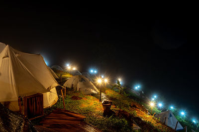 High angle view of illuminated street lights at night