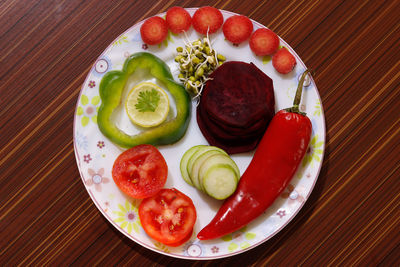 High angle view of fruits in plate on table