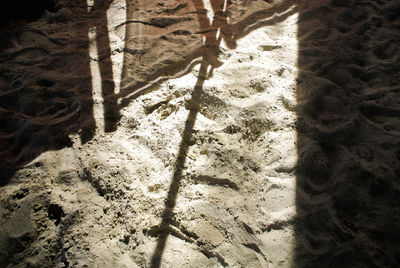 High angle view of shadow on sand at beach