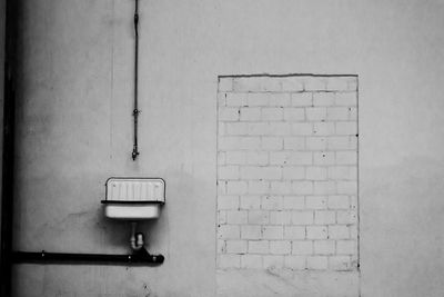 Close-up of sink against wall