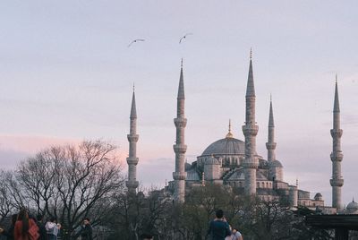 Panoramic view of buildings in city against sky