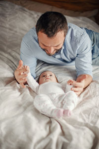 Baby sleeping on bed at home