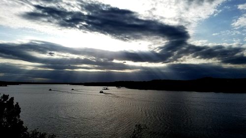 Scenic view of sea against cloudy sky