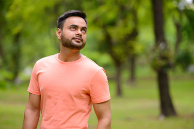 Young man looking away outdoors