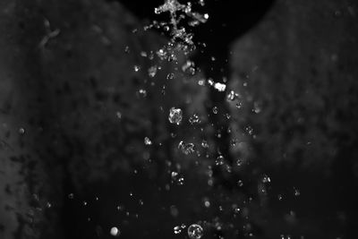 Defocused image of raindrops on water