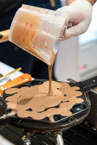 Close-up of hand holding drink