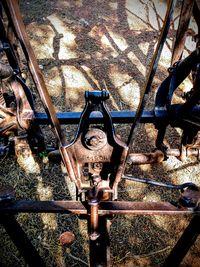 High angle view of rusty metal fence