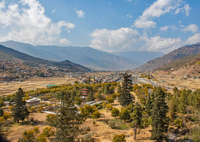 Scenic view of landscape and mountains against sky