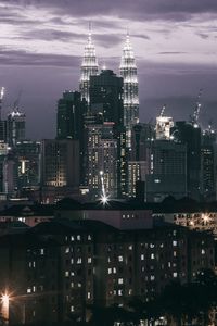 View of skyscrapers lit up at night