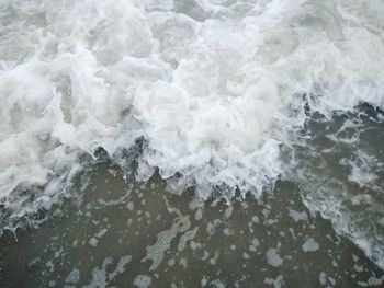 High angle view of surf on beach