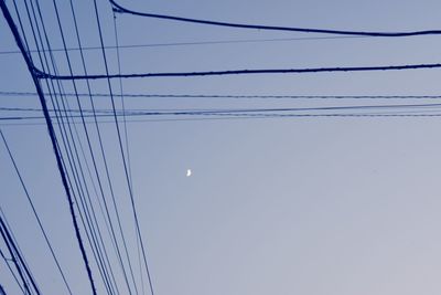 Low angle view of electricity pylon