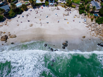 High angle view of people swimming in sea