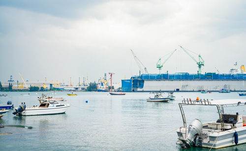 Large ship docked peacefully at busy port. vital role of maritime logistics and transport.