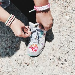 Low section of man and woman standing outdoors