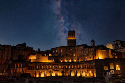 Illuminated buildings in city at night