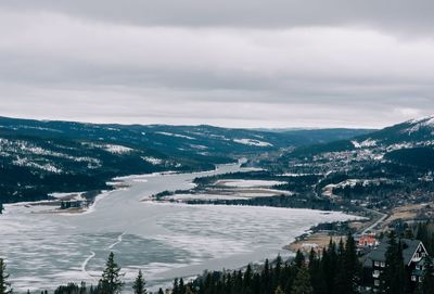 View over a snow covered lake and mountains in are northern sweden