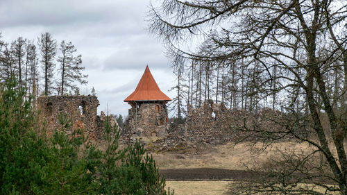  landscape with a view of the castle ruins, the new bright orange roof of the castle tower stands out