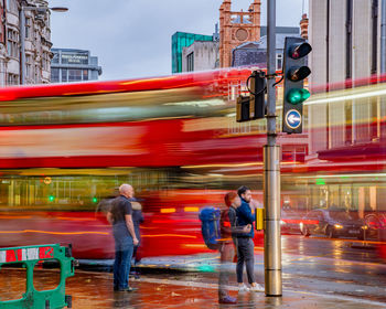 Full length of people on city street