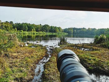 Scenic view of river against sky