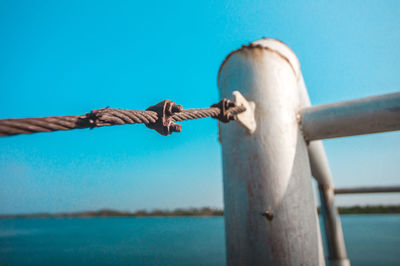 Close-up of rope against blue sky