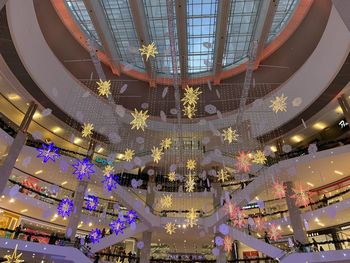 Low angle view of illuminated chandelier in building