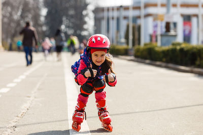 Full length of boy standing on road