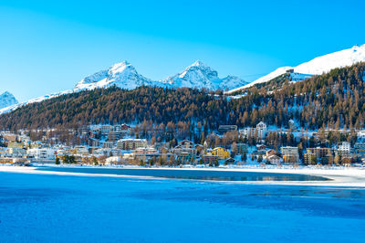 The town and lake of santk moritz in winter. engadin, switzerland.