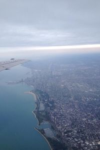 Aerial view of cityscape against sky