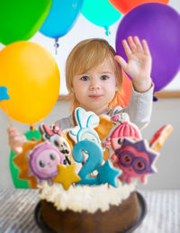 Portrait of cute boy with balloons