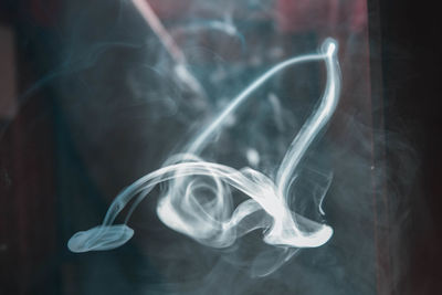 Close-up of smoke against black background