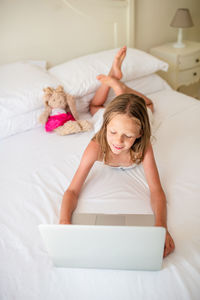 Girl lying on bed at home