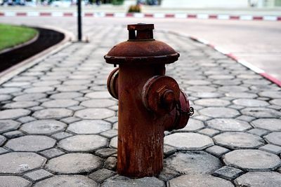 Close-up of fire hydrant on sidewalk