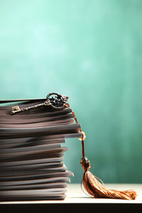 Stack of book with antique key with tassel