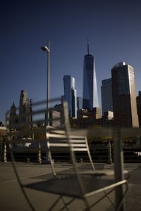 Modern buildings in city against clear sky