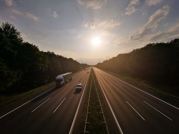 Highway against sky during sunset