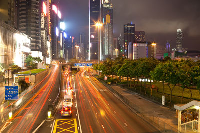 High angle view of light trails on road at night