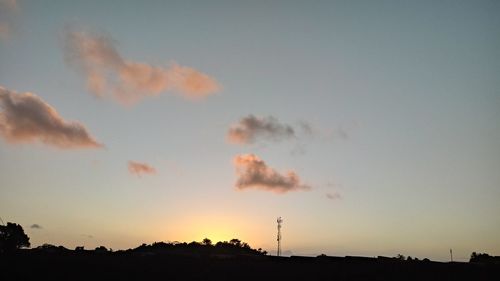 Silhouette landscape against sky during sunset