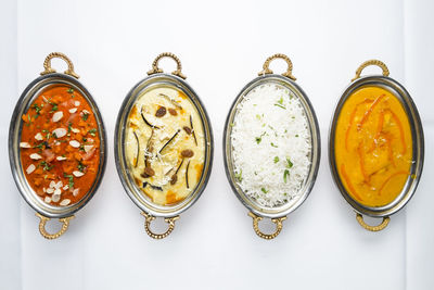 High angle view of food on table against white background