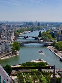 High angle view of bridge over river by buildings in city