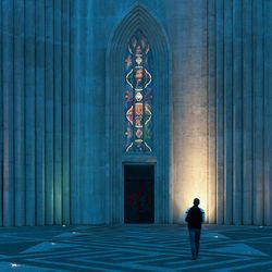 Full length of woman walking on tiled floor