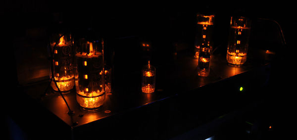 Close-up of illuminated candles in temple