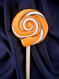 Halloween orange and black handmade artisan lollipop twist on wooden stick