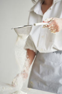 Midsection of woman holding ice cream